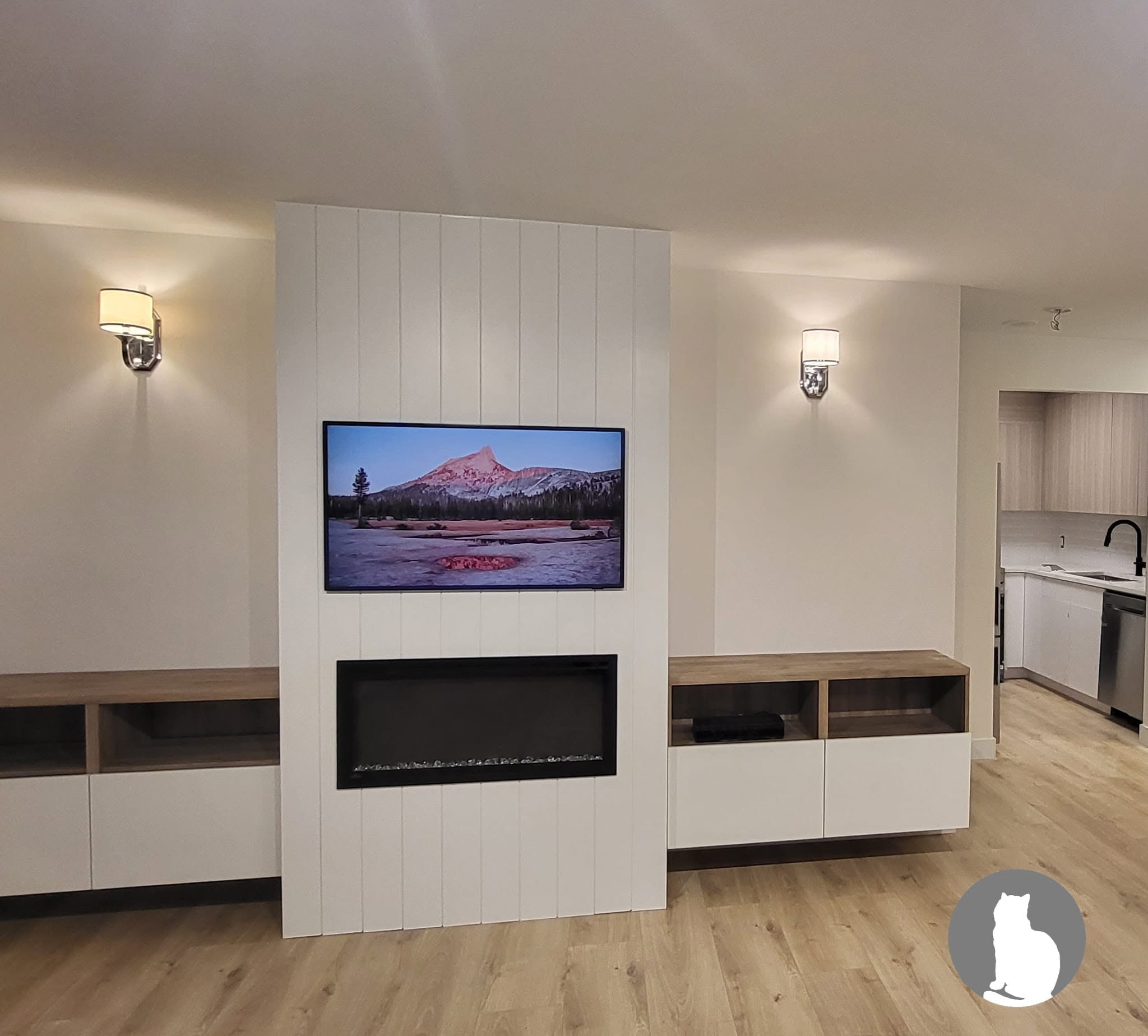 Custom living room feature wall fireplace TV panel built-in cabinets Vancouver